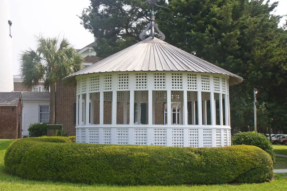 While the general shape of all gazebos is roughly circular, they most often appear in the shape of an octagon or hexagon. This unique model is comprised of enough smaller sections to become a de facto circle, with a conical, highly textured roof overhead adding a dose of contrast. The lattice design of the framing makes for an open and inviting appearance.