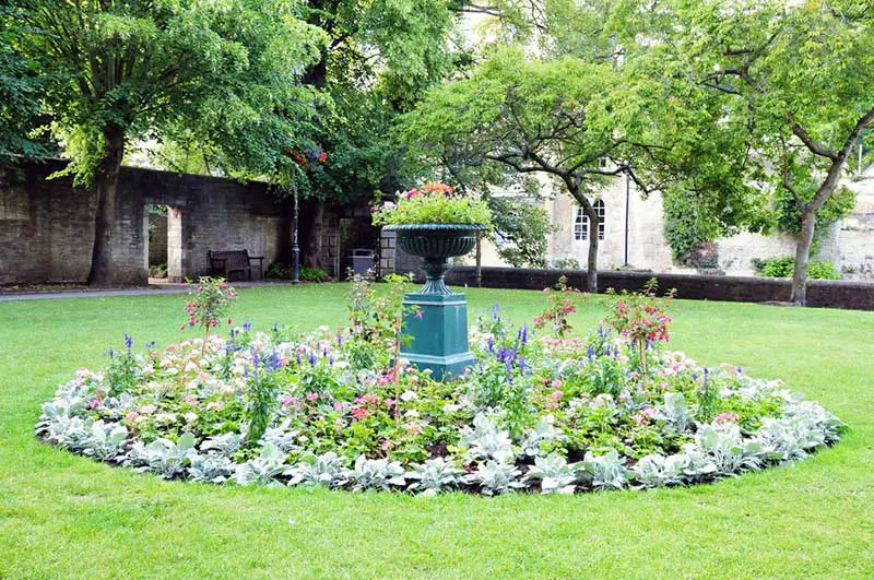 As we've shown before, we love unique container garden ideas. This massive birdbath has transformed into something far more useful and beautiful for us humans to appreciate, surrounded by colorful perennials and a ring of rich greenery. Sure, it may not be a welcome respite for our feathered friends, but it makes for an excellent garden centerpiece.